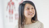 Woman patient smiles in doctor's office